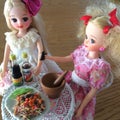 Two friends are enjoy eating Som Tam. Spicy yummy papaya salad.